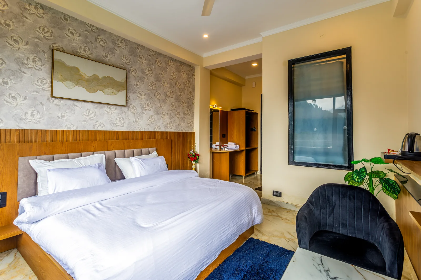 Jr. Suite — bed, armchair and tea station