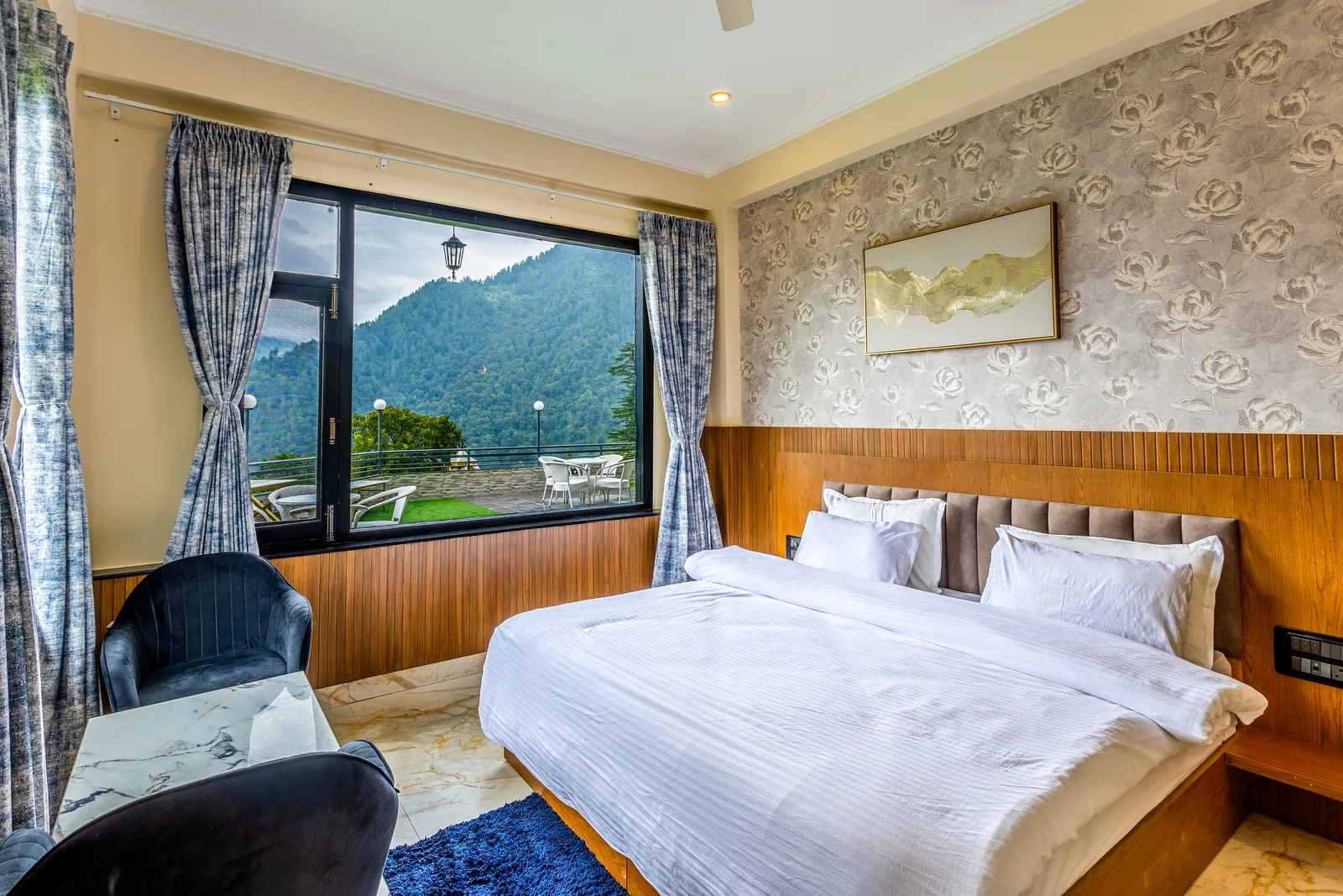 Jr. Suite — king bed and seating by the window