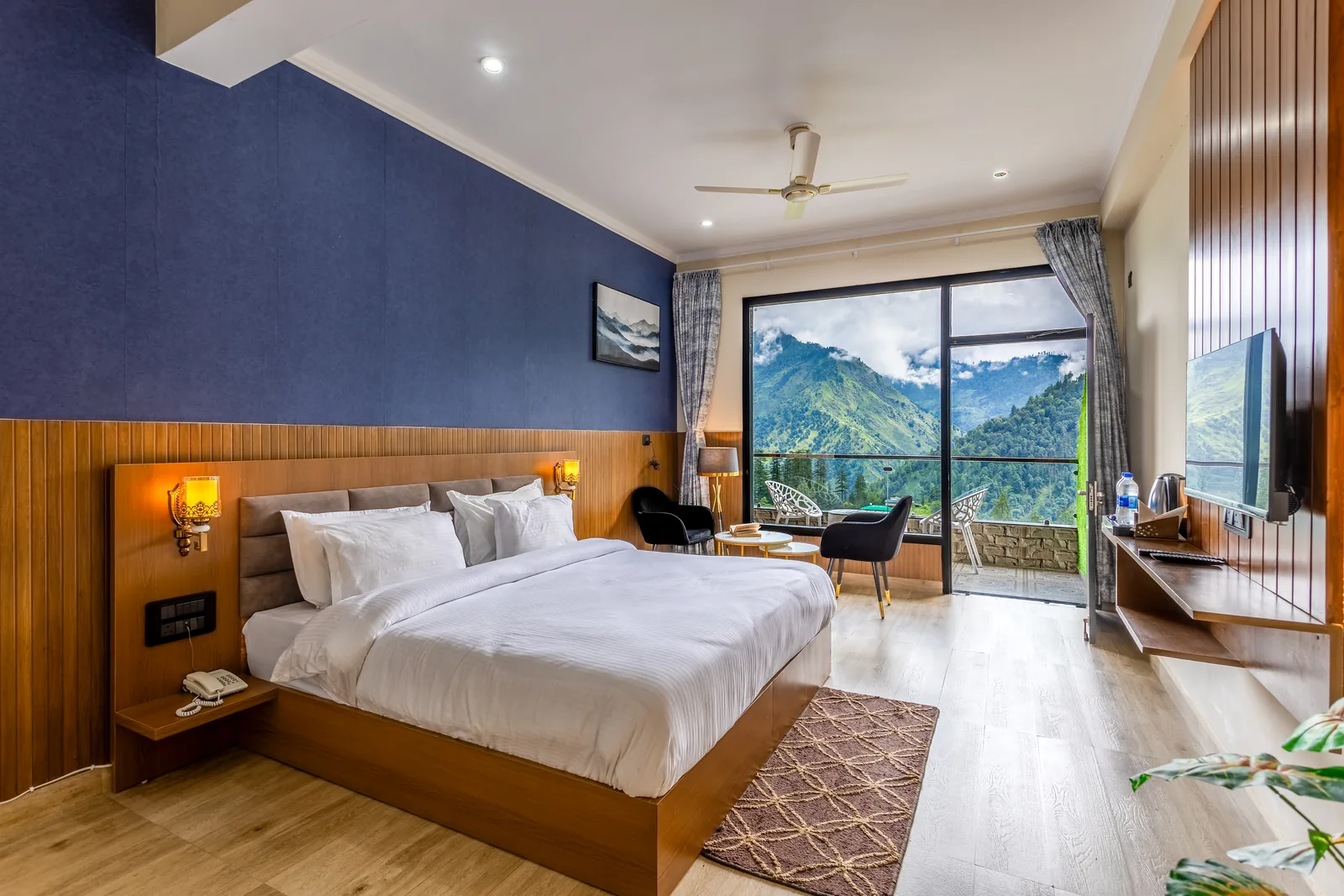 Meadow Suite — the room in full, bed and balcony doors