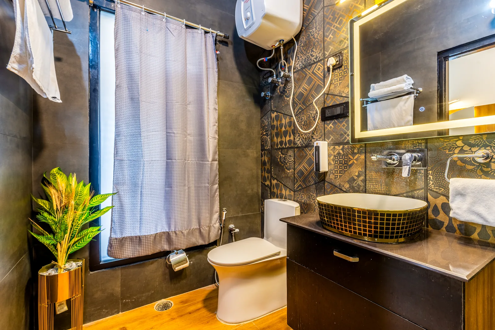Pavilion Suite — the bathroom, with vessel basin and backlit mirror